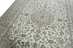 Backside of handmade 2000s Kashan rug showing knot structure and weave density