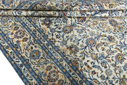 Close-up detail of 2000s Kashan rug from Iran / Persia showing Wool weave