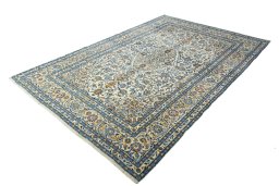 Corner detail of 2000s Kashan rug showing border pattern and Wool pile
