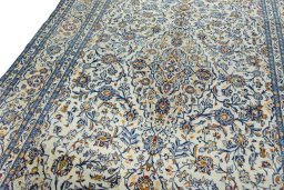 Backside of handmade 2000s Kashan rug showing knot structure and weave density