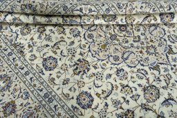 Close-up detail of 2000s Kashan rug from Iran / Persia showing Wool weave