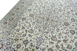 Backside of handmade 2000s Kashan rug showing knot structure and weave density