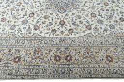 Corner detail of 2000s Kashan rug showing border pattern and Wool pile