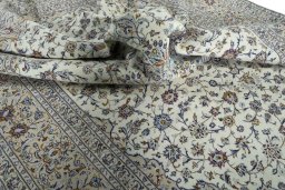 Surface texture of 2000s Kashan rug with natural Wool and intricate pattern
