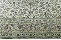Corner detail of 2000s Kashan rug showing border pattern and Wool pile