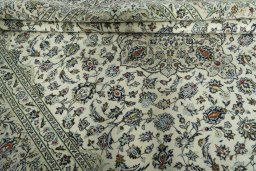 Close-up detail of 2000s Kashan rug from Iran / Persia showing Wool weave