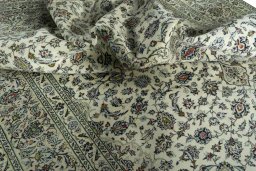 Surface texture of 2000s Kashan rug with natural Wool and intricate pattern