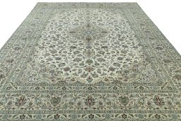 Surface texture of 2000s Kashan rug with natural Wool and intricate pattern