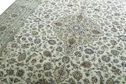Backside of handmade 2000s Kashan rug showing knot structure and weave density
