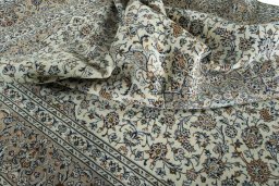 Surface texture of 2000s Kashan rug with natural Wool and intricate pattern