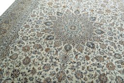 Backside of handmade 2000s Kashan rug showing knot structure and weave density