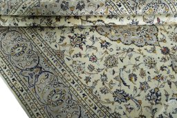 Close-up detail of 2000s Kashan rug from Iran / Persia showing Wool weave