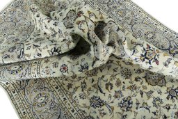 Surface texture of 2000s Kashan rug with natural Wool and intricate pattern