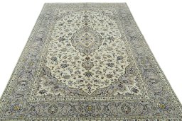 Surface texture of 2000s Kashan rug with natural Wool and intricate pattern