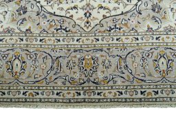 Full view of 2000s Kashan rug from Iran / Persia, 302 × 196 cm in Beige tones