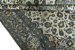 Close-up detail of 2000s Kashan rug from Iran / Persia showing Wool weave