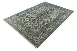 Corner detail of 2000s Kashan rug showing border pattern and Wool pile
