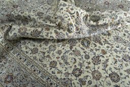 Surface texture of 2000s Kashan rug with natural Wool and intricate pattern