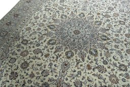 Backside of handmade 2000s Kashan rug showing knot structure and weave density