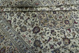 Close-up detail of 2000s Kashan rug from Iran / Persia showing Wool weave