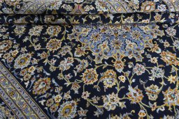 Close-up detail of 2000s Kashan rug from Iran / Persia showing Wool weave
