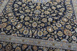 Close-up detail of 2000s Kashan rug from Iran / Persia showing Wool weave