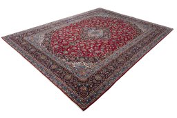 Corner detail of 2000s Kashan rug showing border pattern and Wool pile