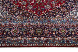 Full view of 2000s Kashan rug from Iran / Persia, 403 × 305 cm in Red tones
