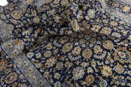 Surface texture of 2000s Kashan rug with natural Wool and intricate pattern
