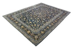 Corner detail of 2000s Kashan rug showing border pattern and Wool pile