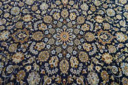 Central medallion detail of 2000s Kashan rug from Iran / Persia