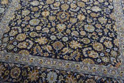 Close-up detail of 2000s Kashan rug from Iran / Persia showing Wool weave