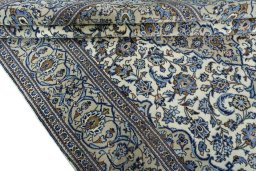 Close-up detail of 2000s Kashan rug from Iran / Persia showing Wool weave