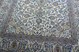 Close-up detail of 2000s Kashan rug from Iran / Persia showing Wool weave