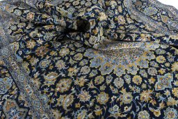 Surface texture of 2000s Kashan rug with natural Wool and intricate pattern