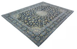 Corner detail of 2000s Kashan rug showing border pattern and Wool pile