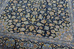 Close-up detail of 2000s Kashan rug from Iran / Persia showing Wool weave