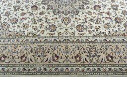 Corner detail of 2000s Kashan rug showing border pattern and Wool pile
