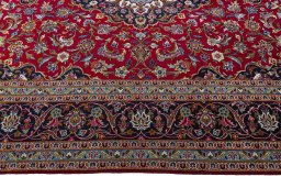 Corner detail of 2000s Kashan rug showing border pattern and Wool pile