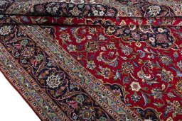 Close-up detail of 2000s Kashan rug from Iran / Persia showing Wool weave