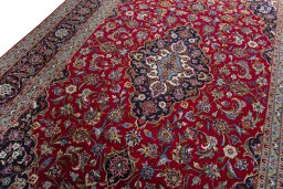 Backside of handmade 2000s Kashan rug showing knot structure and weave density