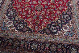 Close-up detail of 2000s Kashan rug from Iran / Persia showing Wool weave