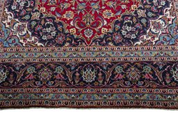 Full view of 2000s Kashan rug from Iran / Persia, 390 × 251 cm in Red tones