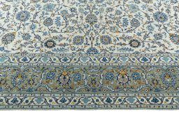 Corner detail of 2000s Kashan rug showing border pattern and Wool pile