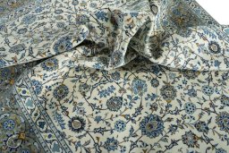 Surface texture of 2000s Kashan rug with natural Wool and intricate pattern