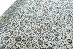 Backside of handmade 2000s Kashan rug showing knot structure and weave density