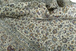Surface texture of 2000s Kashan rug with natural Cork and intricate pattern