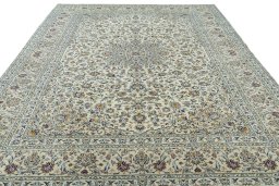 Surface texture of 2000s Kashan rug with natural Cork and intricate pattern