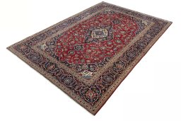Corner detail of 2000s Kashan rug showing border pattern and Wool pile