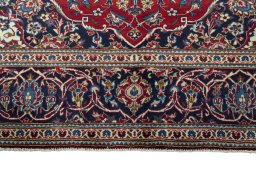 Full view of 2000s Kashan rug from Iran / Persia, 293 × 200 cm in Red tones